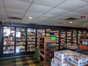 A store with shelves full of beer and liquor.