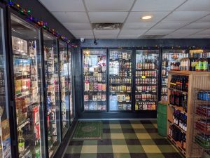 The inside of a store with many different types of beer.